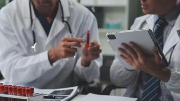 Doctors in office working on medical report video