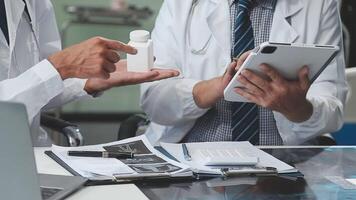 Doctors in office working on medical report video