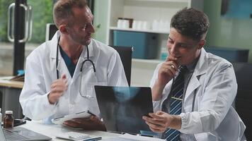 Doctors in office working on medical report video