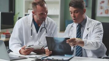 Doctors in office working on medical report video