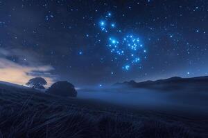 Field with a Mountain in the Background and a Starry Sky photo