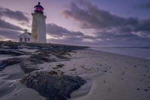 Lighthouse on Rocky Beach with Cloudy Sky, Nature Background photo