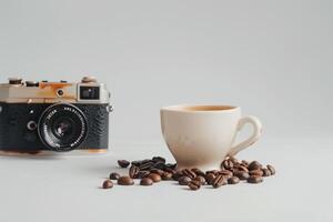 Coffee beans and old camera on white background photo