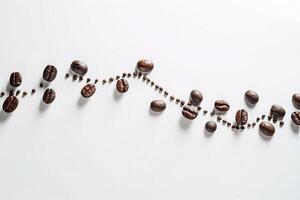 Coffee Beans Arranged in a Line on a White Surface Background photo