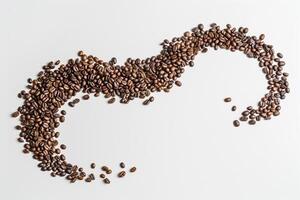 Coffee Beans Arranged in the Shape of a Heart on a White Background photo