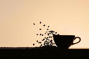 Coffee Beans Falling into a Cup Background photo