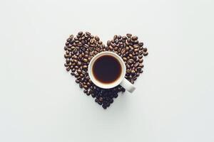 Coffee beans in heart shape on white background photo