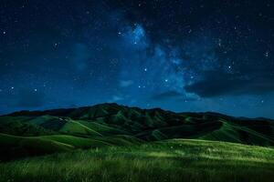 The Night Sky over a Green Hill with Grass and Stars Background photo