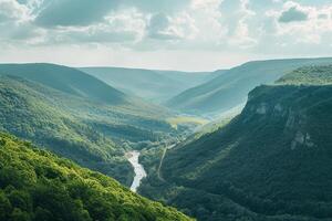 A view of a valley with a river running through it background photo