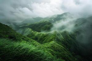 a green mountain range with clouds and grass background photo