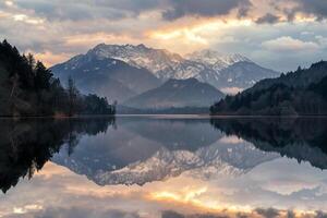 a lake with mountains reflected in it at sunset background photo
