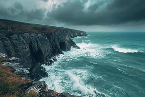 a large cliff with a large ocean in the background photo