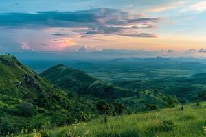 a view of a mountain range with a sunset background photo