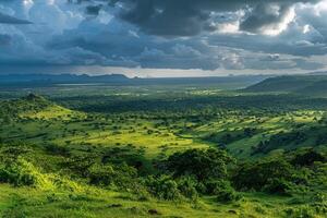 a view of the green hills and mountains under a cloudy sky background photo