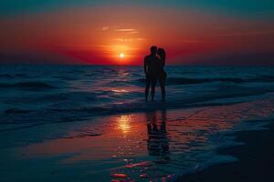 a couple standing on the beach at sunset with a nature background photo