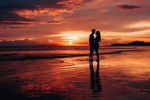a couple standing on the beach at sunset with a nature background photo