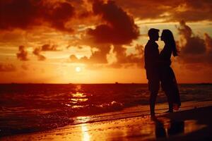 a couple kissing on the beach at sunset with a nature background photo