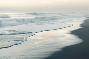 A beach with waves and a foggy sky background photo