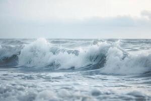 A person is standing on the beach in the ocean background photo