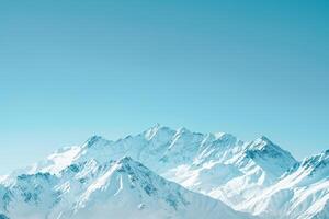 a mountain range with snow covered peaks background photo