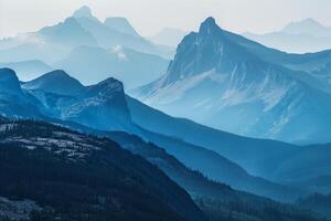 a mountain range with trees and mountains background photo
