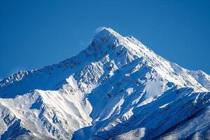 a mountain with snow on it background photo