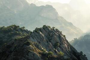 a mountain range with a large mountain in the background photo