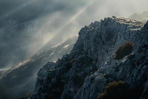 a mountain with a view of the sun shining through the clouds background photo
