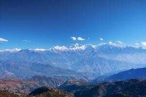 A view of mountains from a high vantage point background photo
