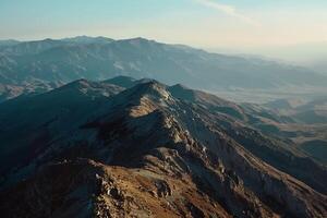 An Aerial View of Mountains and Valleys with a Scenic Background photo
