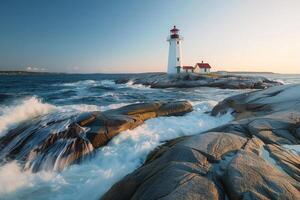 A Lighthouse Sits on the Rocks Near the Ocean with a Scenic Background photo