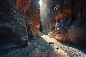 A Narrow Canyon with Rocks and Dirt in the Background photo
