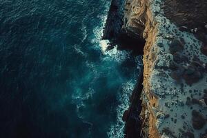 An Aerial View of the Ocean and Cliffs Background photo