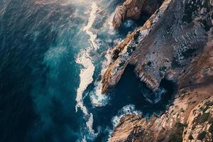 an aerial view of the ocean and cliffs background photo