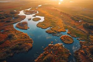 aerial view of a river and marshland at sunset background photo
