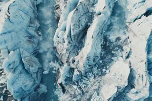 an aerial view of a glacier with ice and water background photo