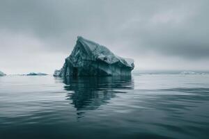 iceberg in the ocean with fog and clouds background photo