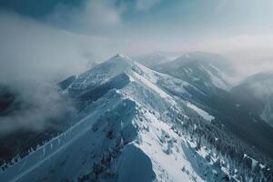 a snowy mountain top with trees and clouds background photo