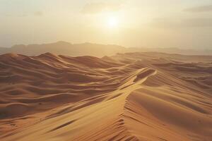 the sun is setting over a desert with sand dunes background photo