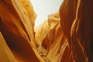 a narrow canyon with rocks and sand background photo
