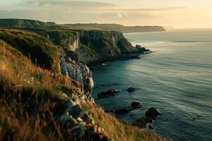 a view of the ocean and cliffs at sunset with background photo