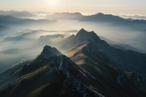 A mountain range with fog and mountains in the background photo