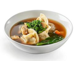 a bowl of soup with dumplings and spinach background photo