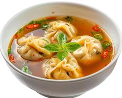 a bowl of soup with dumplings in it background photo