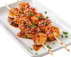shrimp skewers with sauce and green onions photo