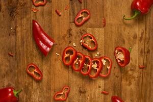 Slices of red pepper on a cutting board photo