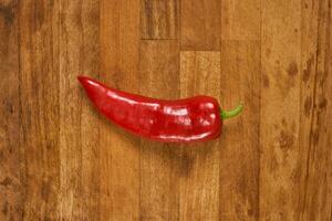 Slices of red pepper on a cutting board photo