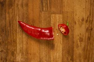 Slices of red pepper on a cutting board photo