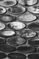 Texture of mother-of-pearl mosaic round tiles, close-up photo