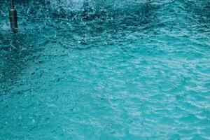 Texture of blue water in a fountain photo